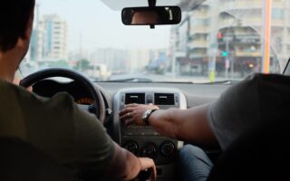 two person riding vehicle during daytime
